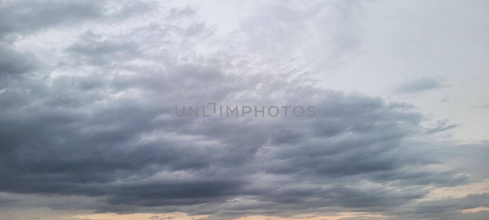 image of colorful sky with dark clouds in late afternoon in Brazil