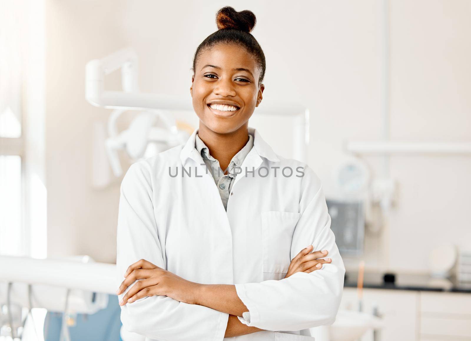 a young female dentist in her office.