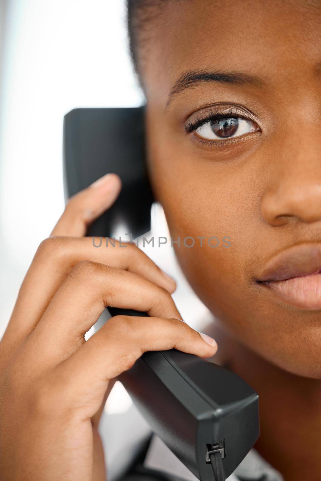 a young woman on a call at work.