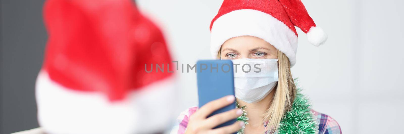 Portrait of woman take video of friend on smartphone, content for internet channel. Celebrating new year with friend during quarantine. Friendship concept