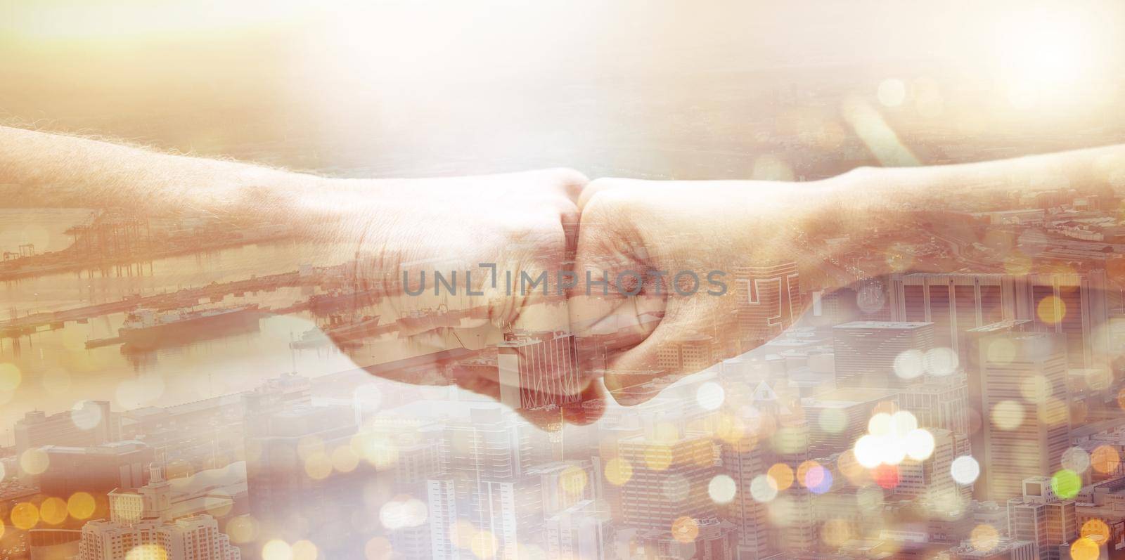 two unrecognizable people giving each other a fist bump.