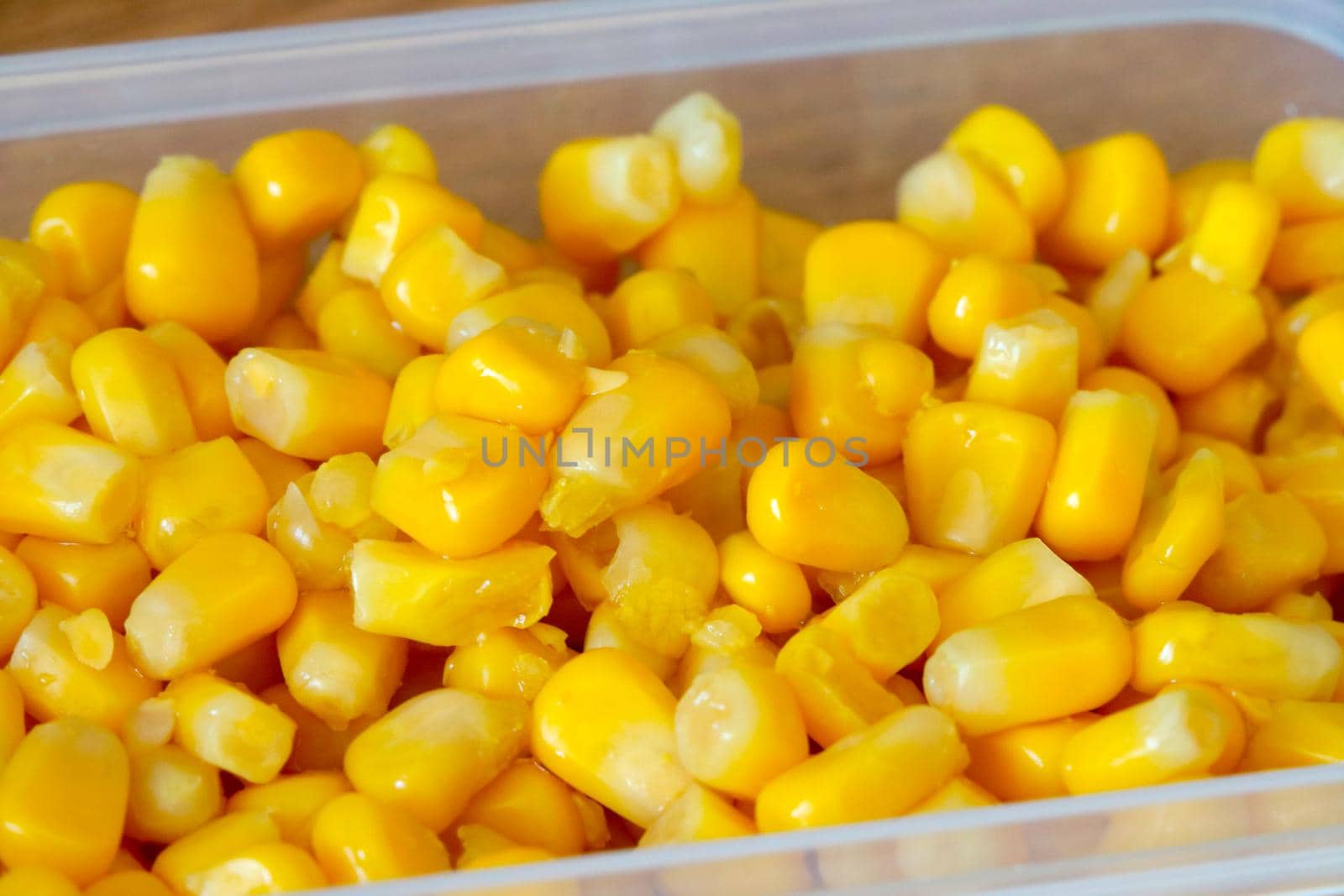 The container contains yellow tasty and sweet corn. by kip02kas