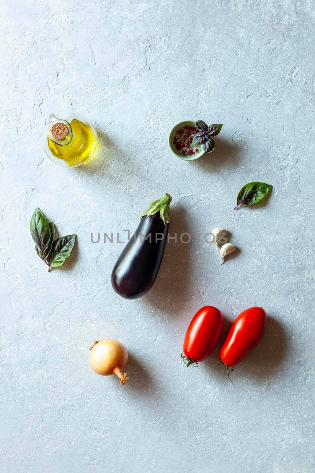 mediterranean cuisine organic vegetables on grey background, top view