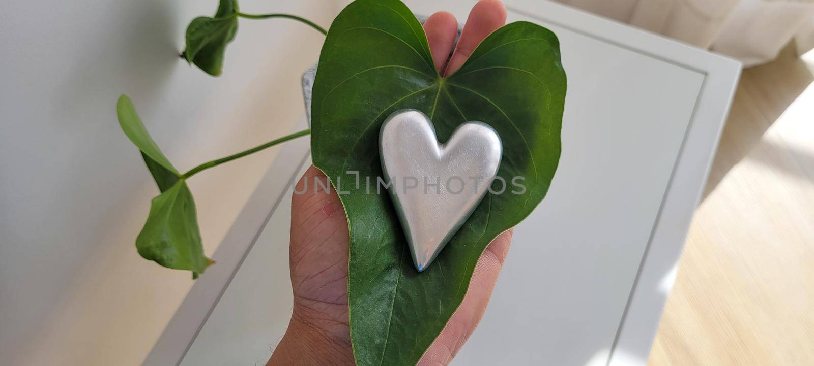 romantic background of iron shiny heart with marble and leaf by sarsa