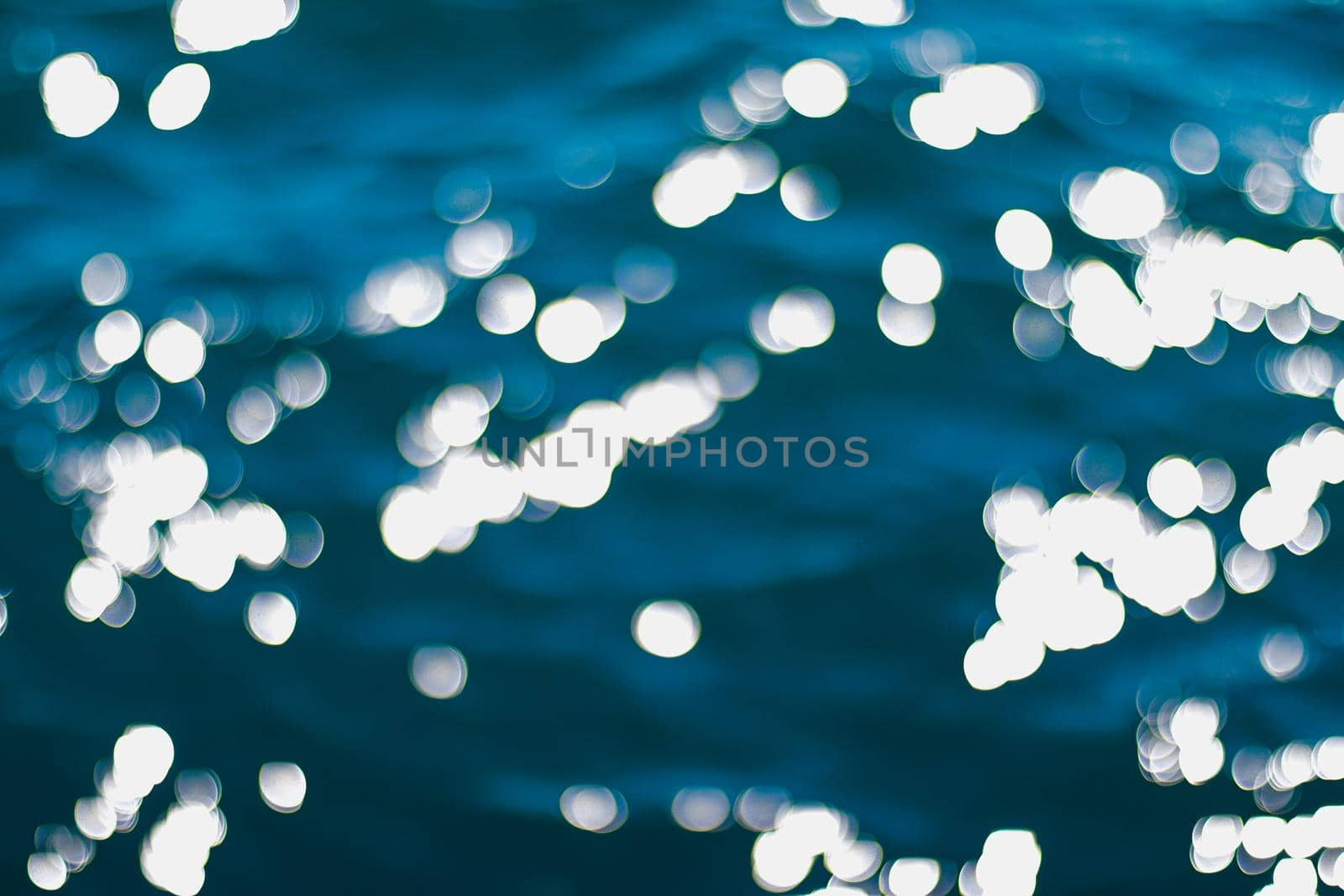 Blurry deep blue sea water background, dark ocean as nature and environmental design concept