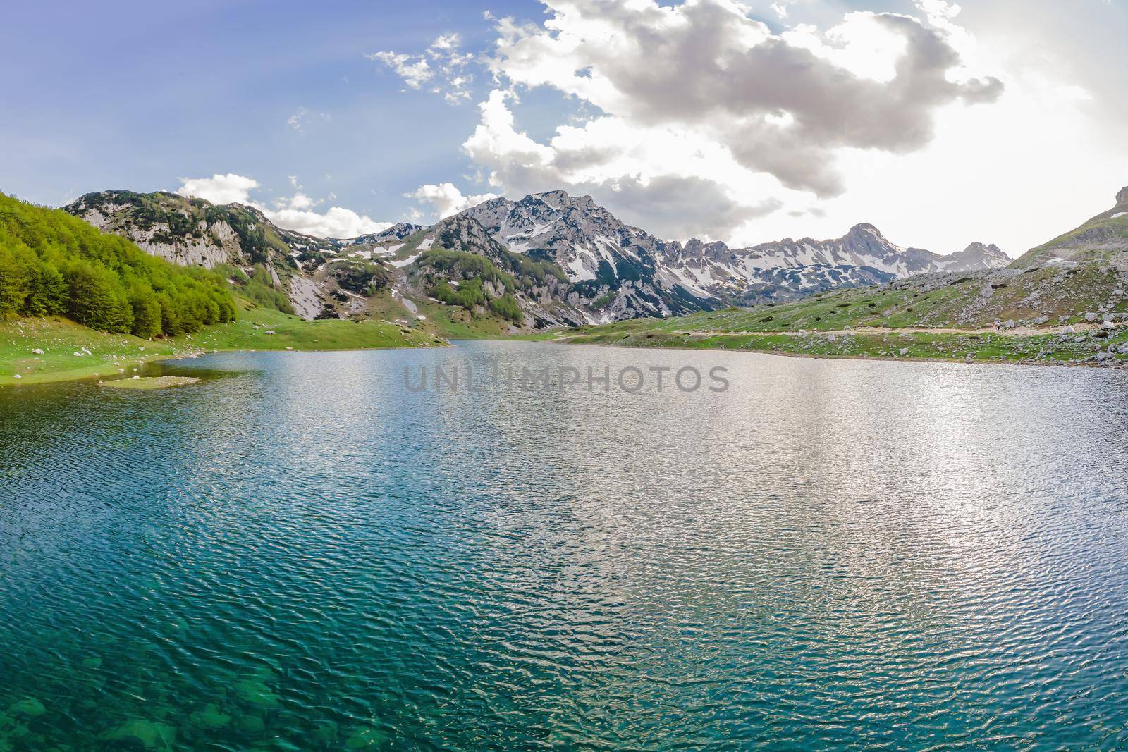 Mountain lake landscape on Durmitor mountain in Montenegro beautiful Durmitor National park with lake glacier and reflecting mountain.