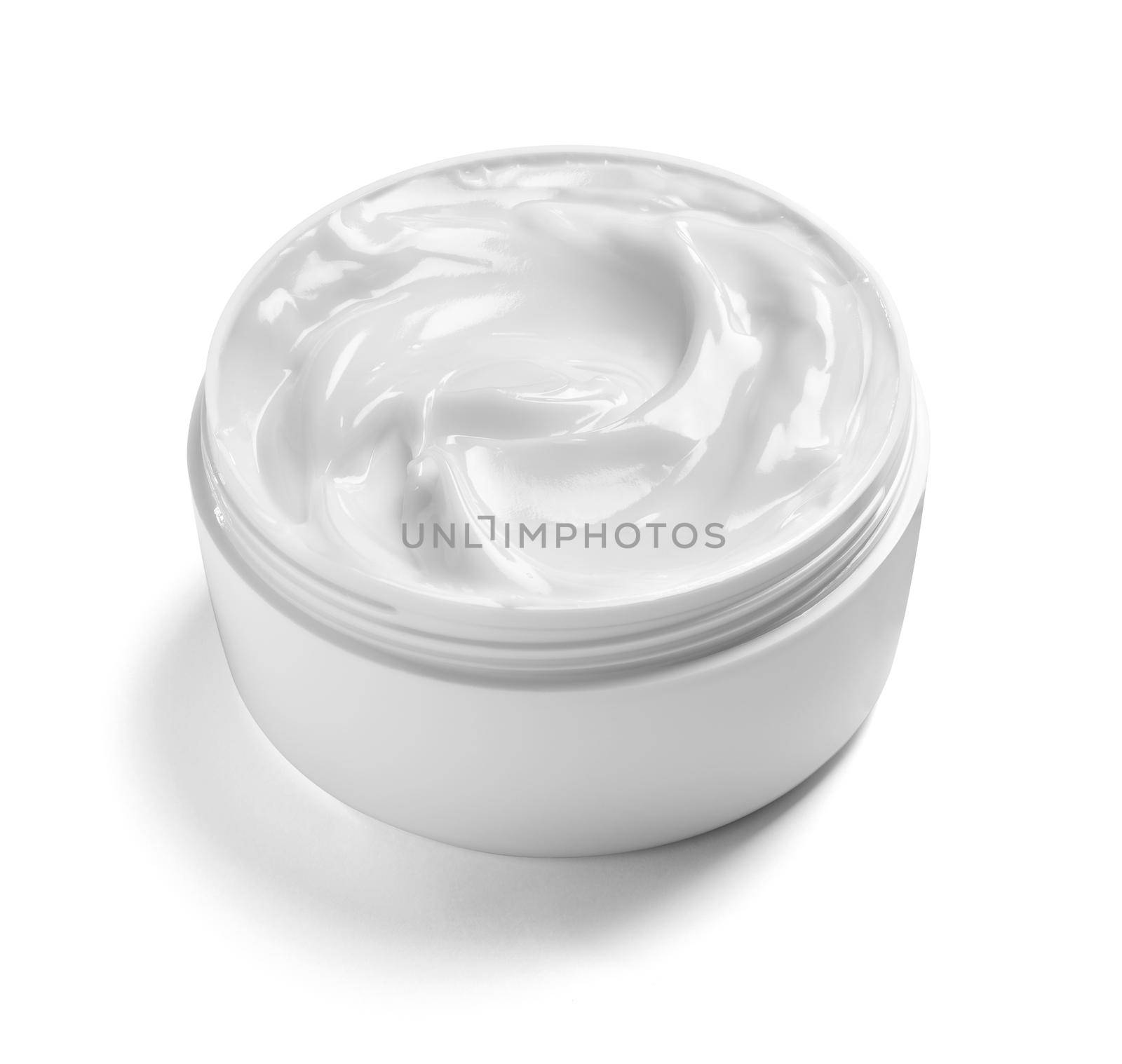 close up of a white beauty cream in a container on white background