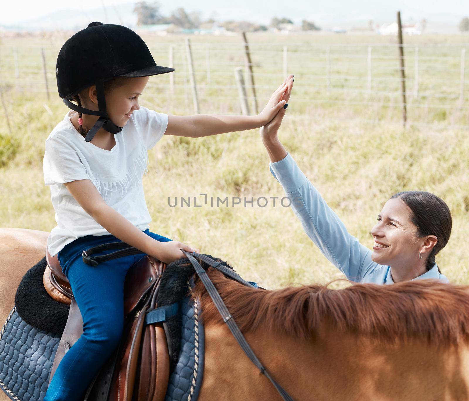 My favourite learner. young girl with her instructor with a horse outdoors in a forest. by YuriArcurs