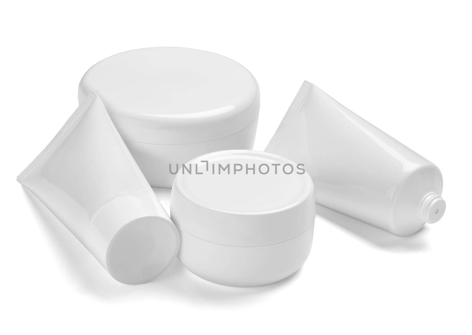 close up of a white beauty cream container and tube on white background