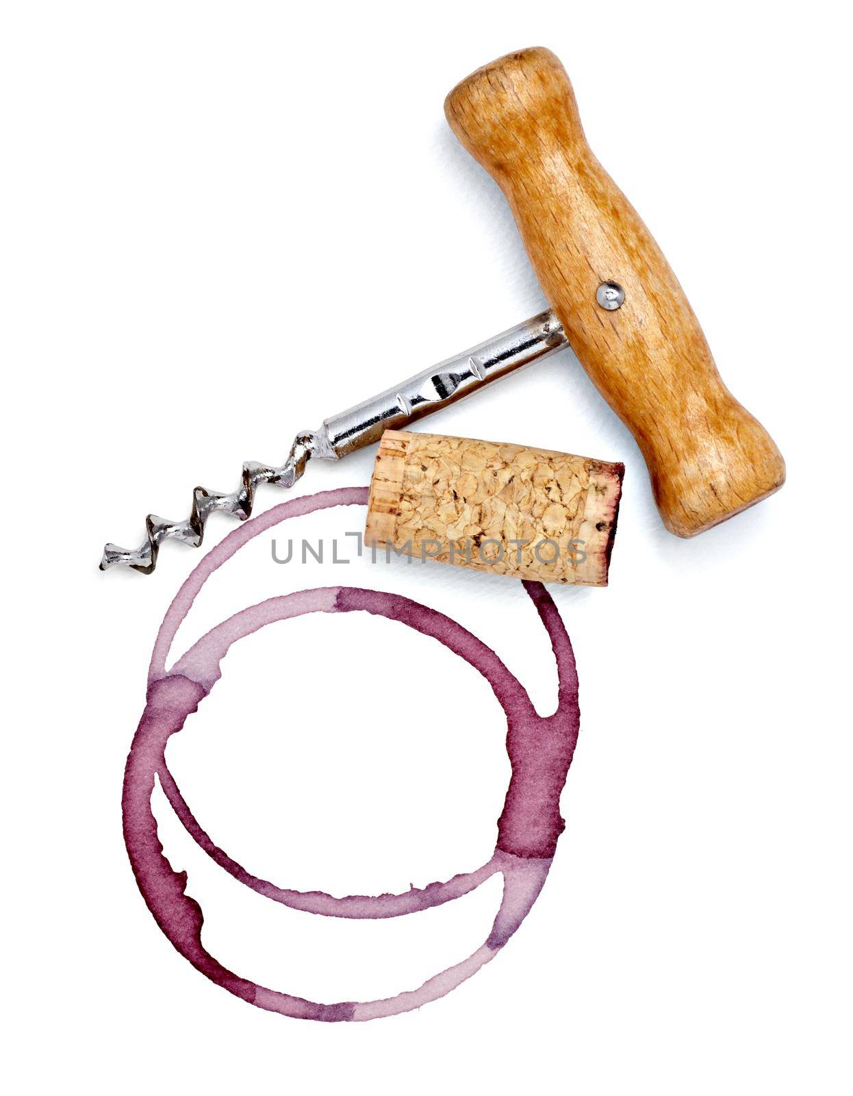 close up of a wine stain and corkscrew and cork cap on white background