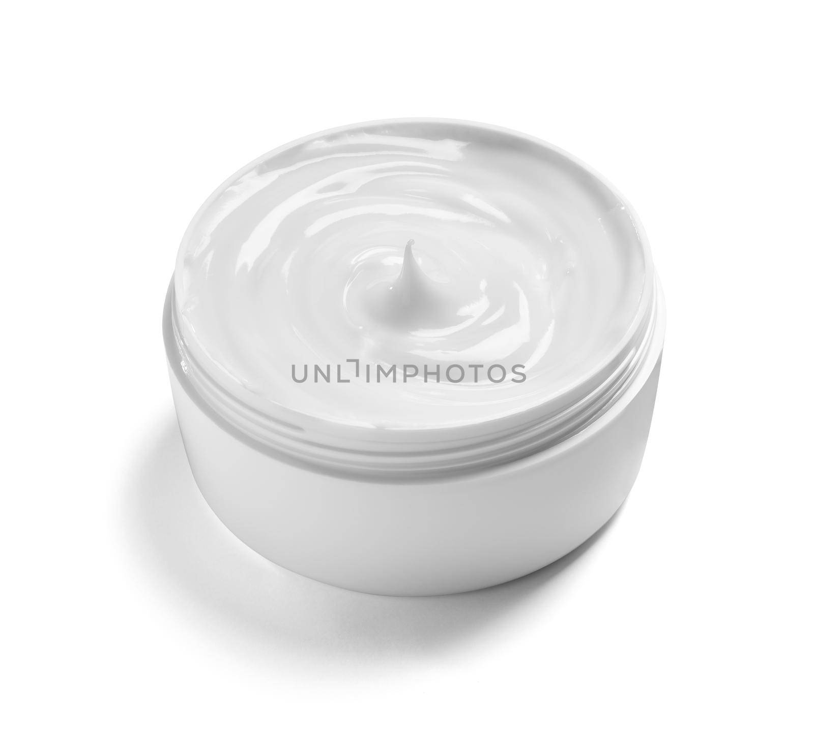 close up of a white beauty cream in a container on white background