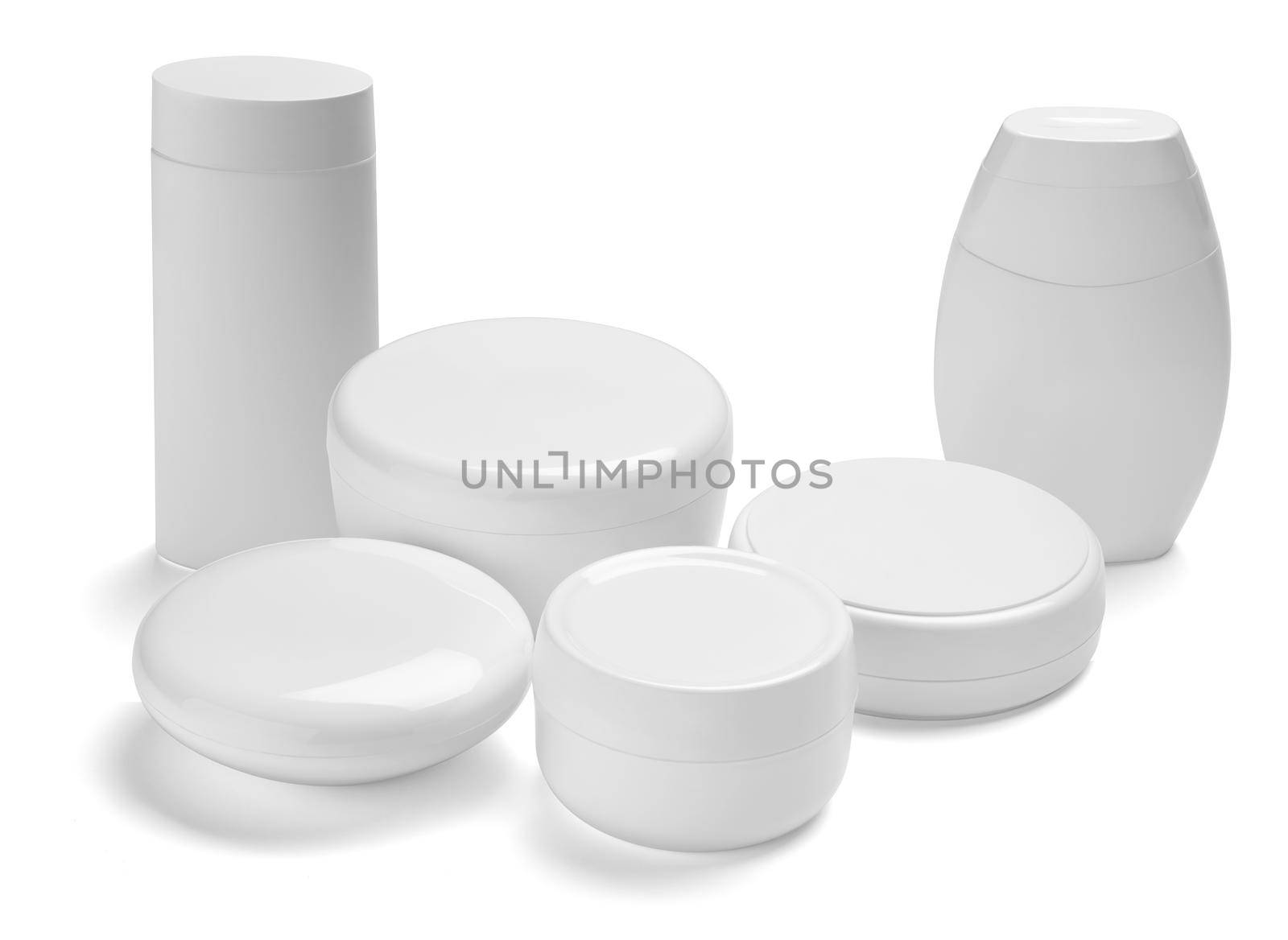 close up of a white beauty cream container and tube on white background