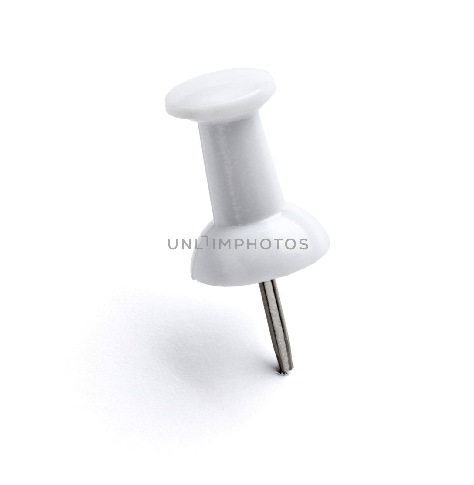 close up of push pin paperclip on white background