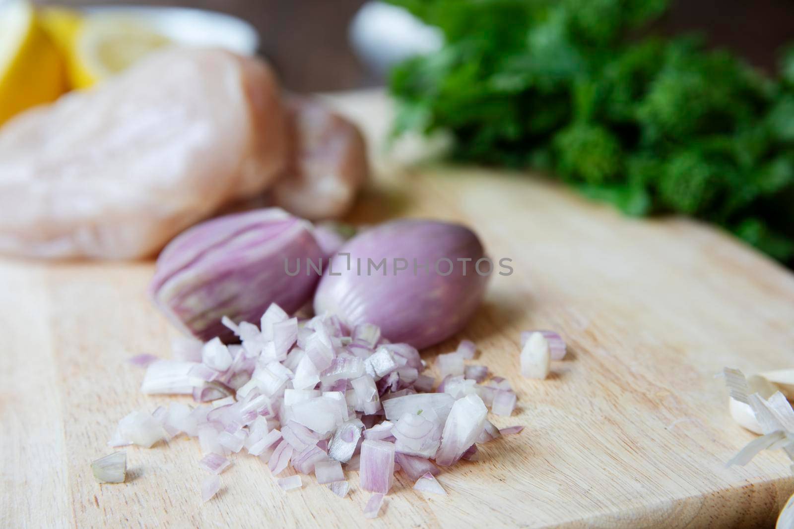 Fresh chopped shallots on a cutting board