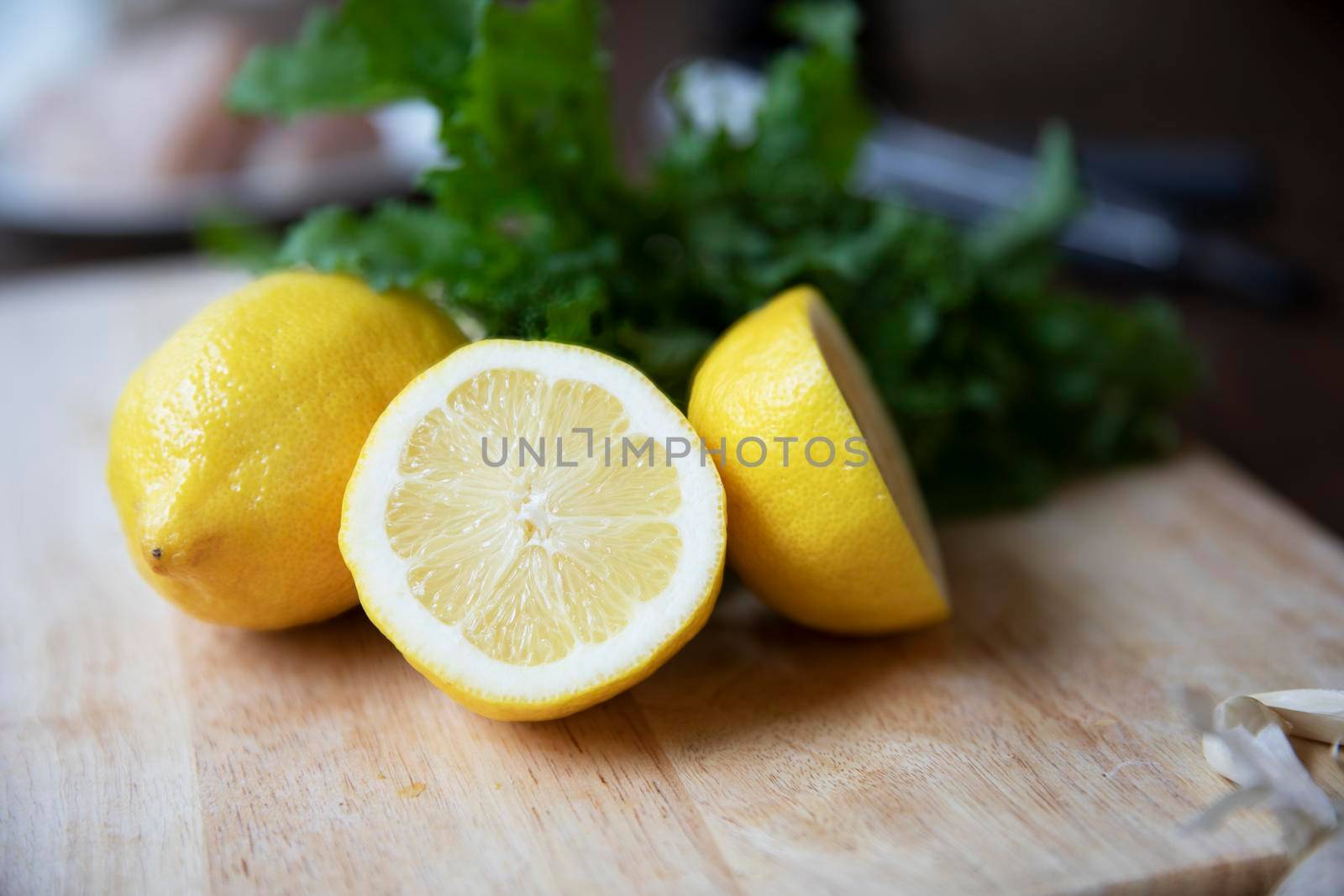 Whollr and halved lemons on cutting board