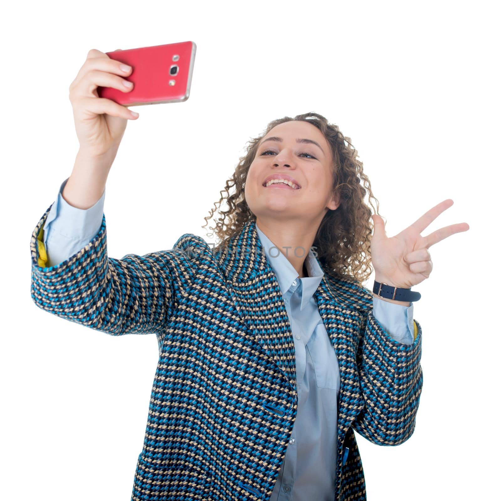 Close up portrait of a cute lovely woman taking selfie and showing peace sign with fingers over white background
