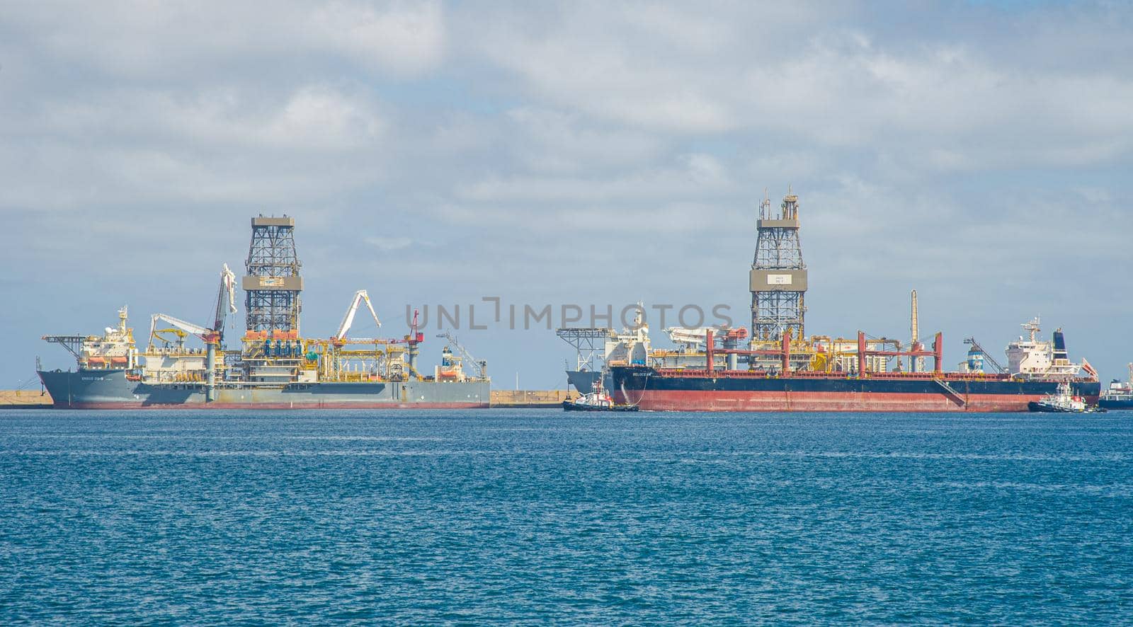 Picture of Las palmas Canary Island port with large ships carrying cargo, large container cranes and passenger ships