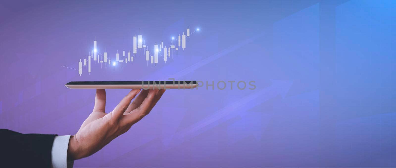 Hand of businessman holding tablet analysis stock market graph growth and increase of chart positive indicators. Hand holding tablet show stock chart on light gray background. copy space banner