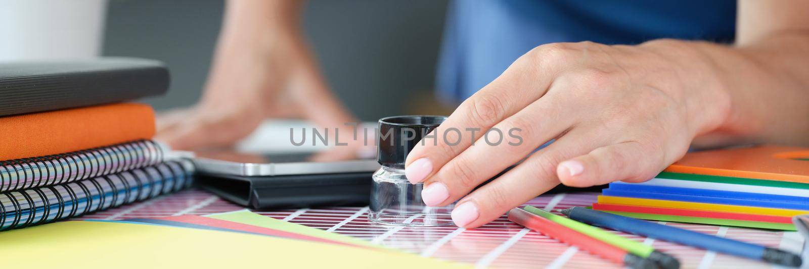 Designer lady in search for perfect colour for project, use magnifying glass by kuprevich