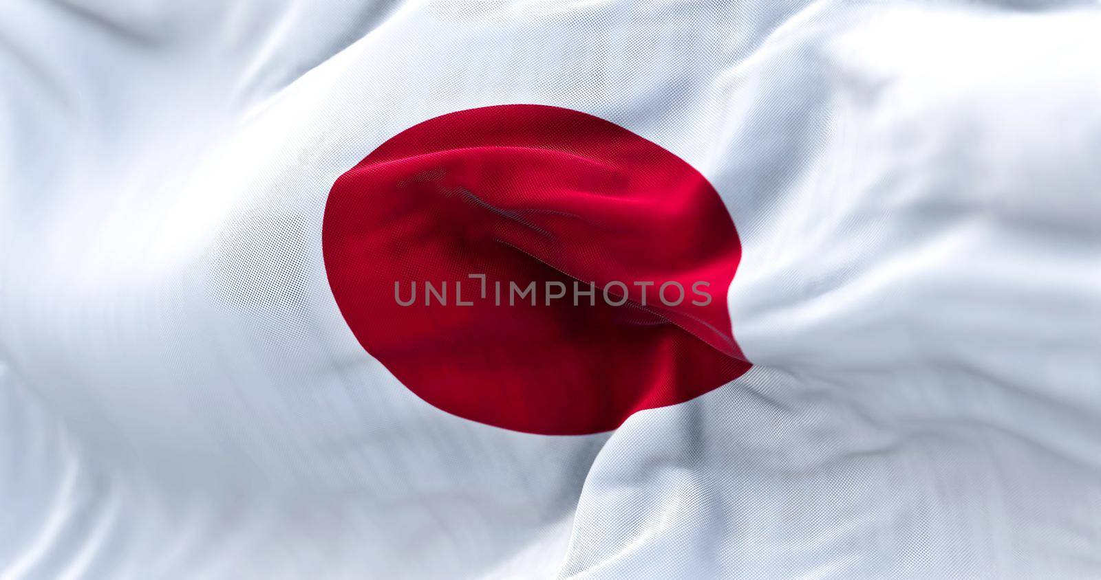 Close-up view of the Japanese national flag waving in the wind by rarrarorro