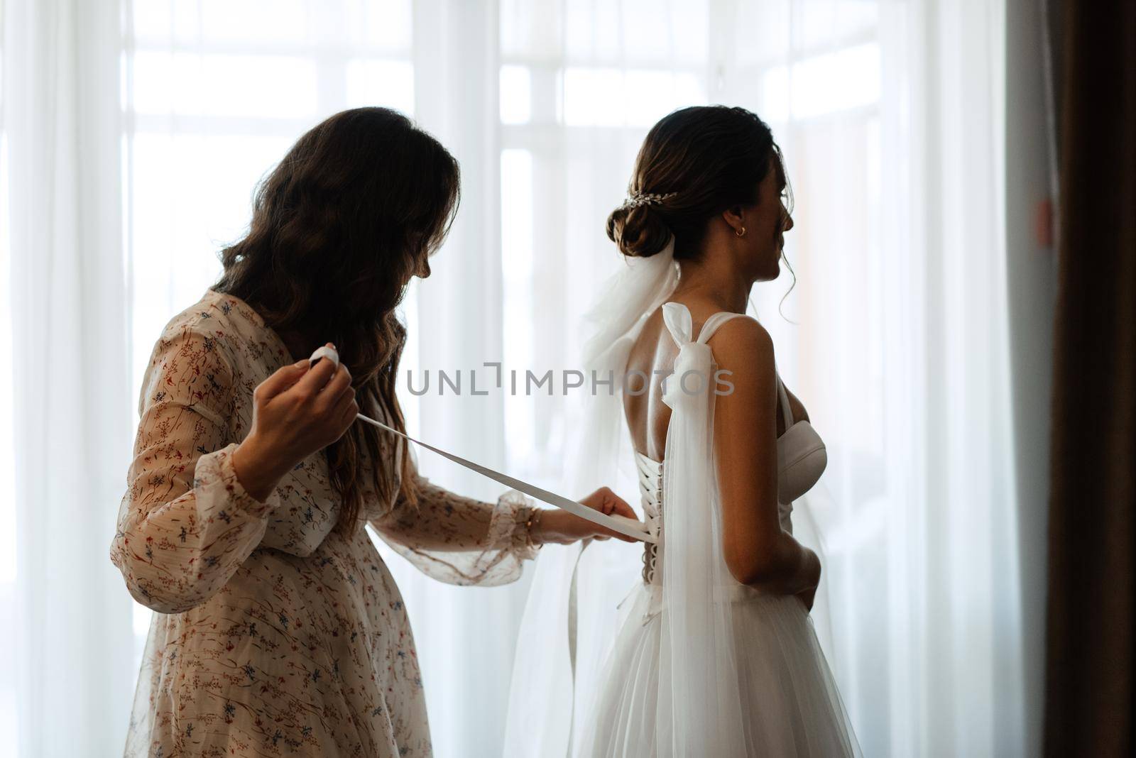 bride in a white dress at the training camp inside the hotel