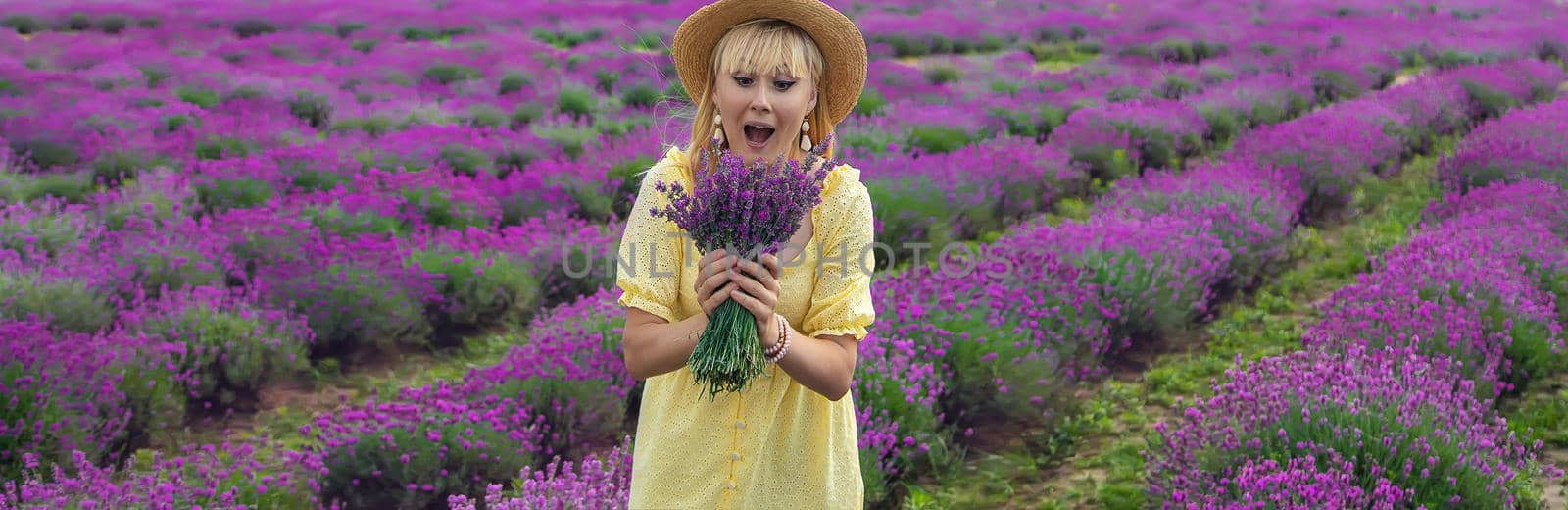 Beautiful woman in lavender field. Selective focus. by yanadjana