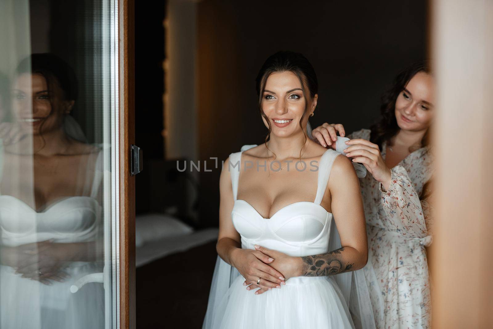 bride in a white dress at the training camp inside the hotel
