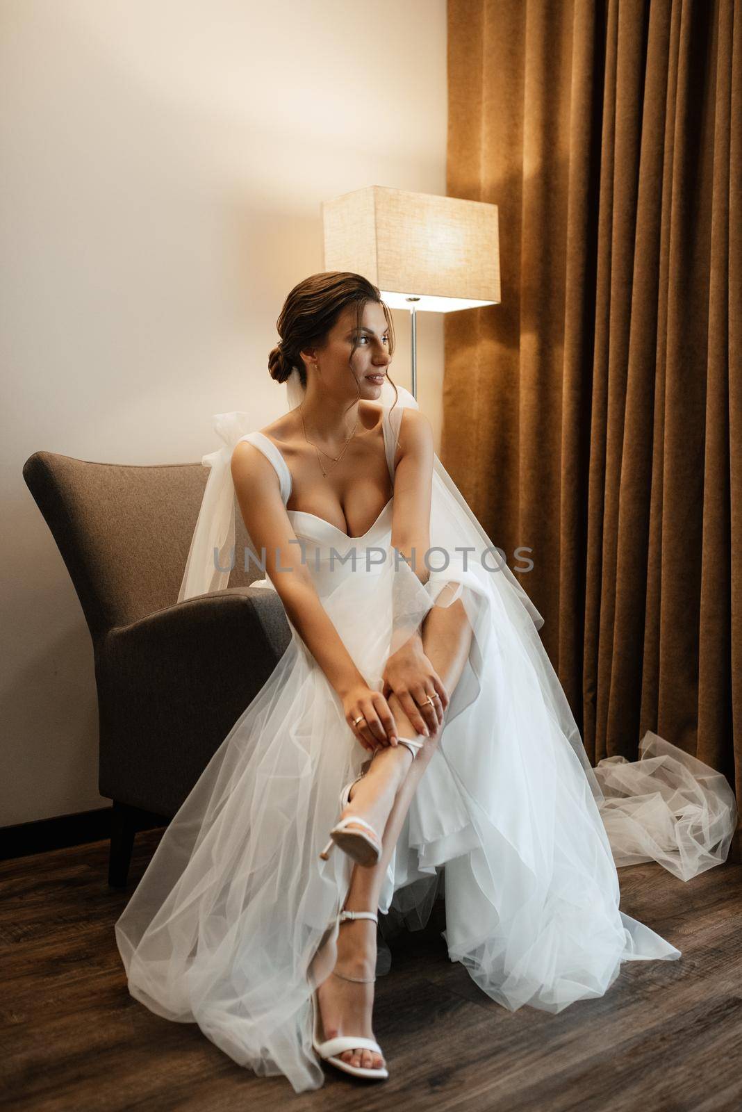 bride in a white dress at the training camp inside the hotel