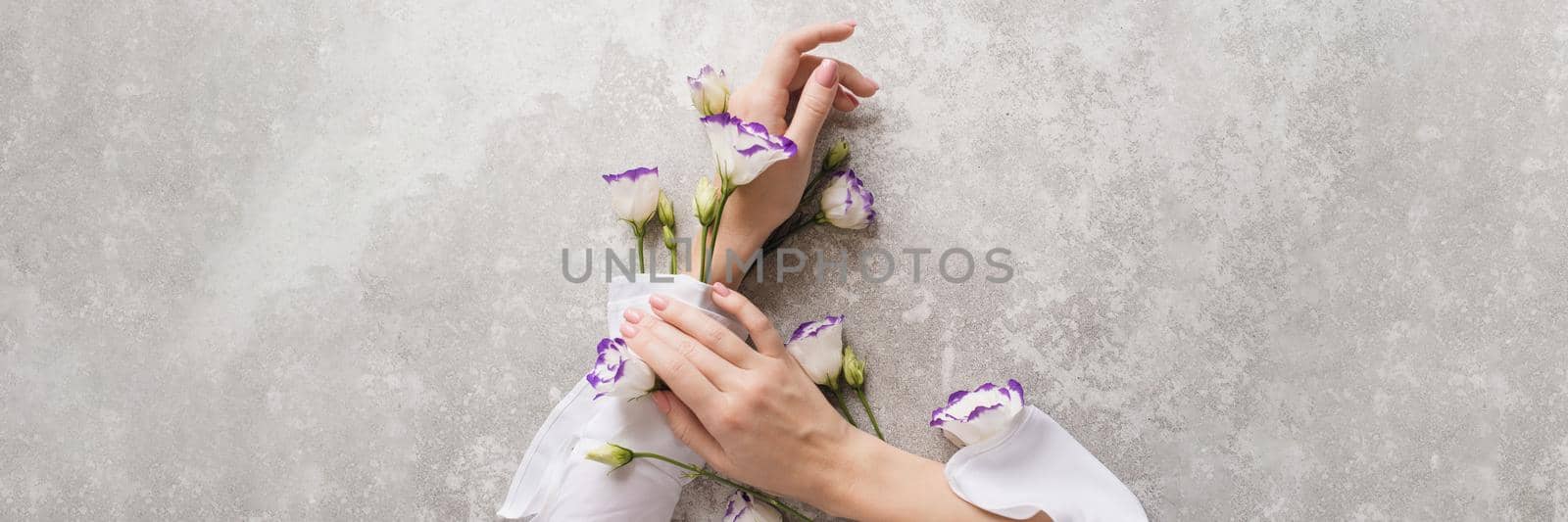 Creative illustration of hand skin care, natural cosmetics components. Hands of a cute girl with light white sleeves with flowering plants. Web banner