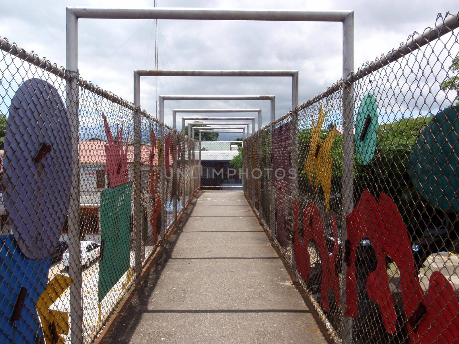 Artistic Road overpass fenced for pedestrian safety in San Jose, Costa Rica