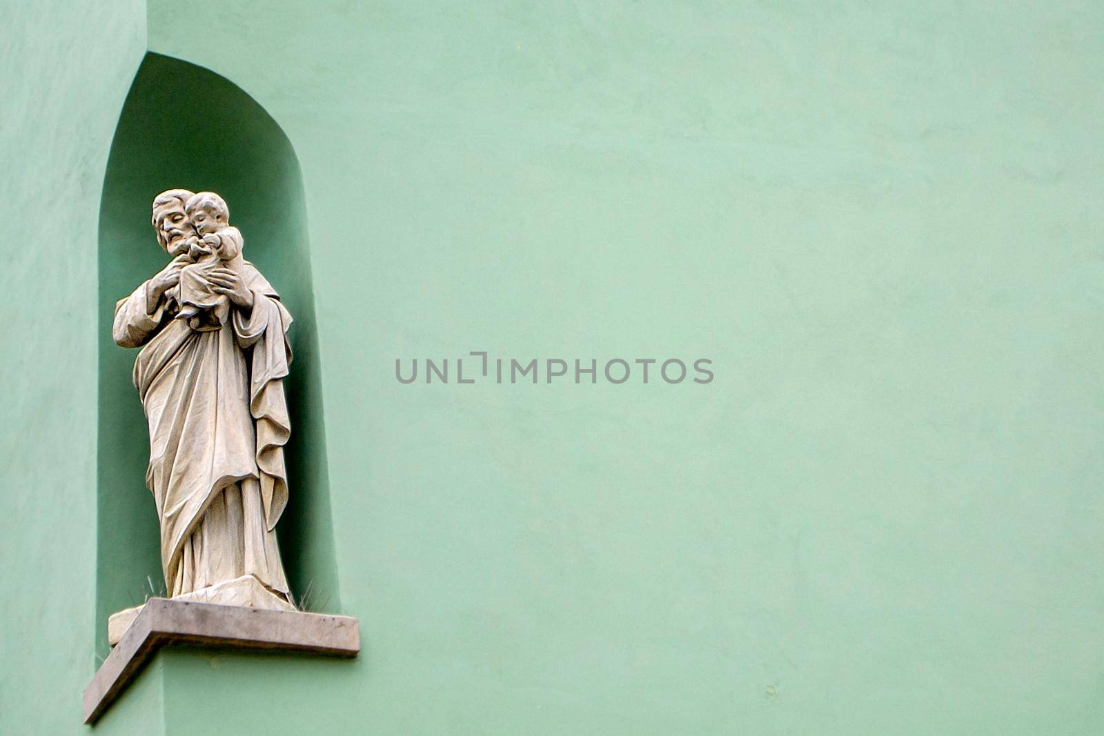 A monk with a child on a mint background. The antiques. High quality photo