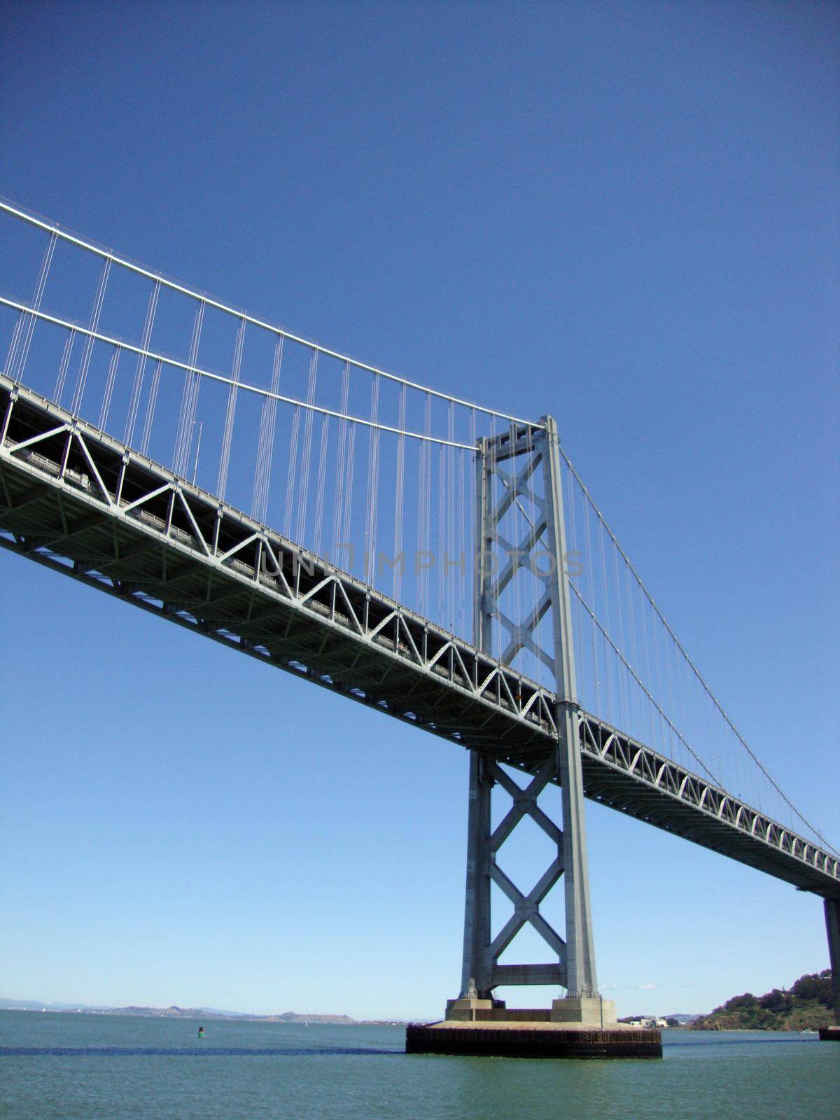 Bay Bridge spanning San Francisco Bay viewed from the water.