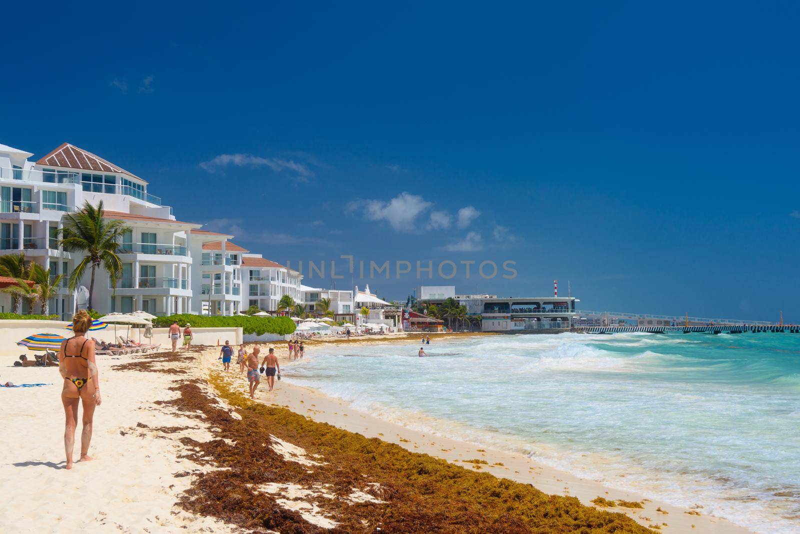 Woman in sexy brasilian bikini on a sandy beach near hotel in Playa del Carmen, Mexico by Eagle2308