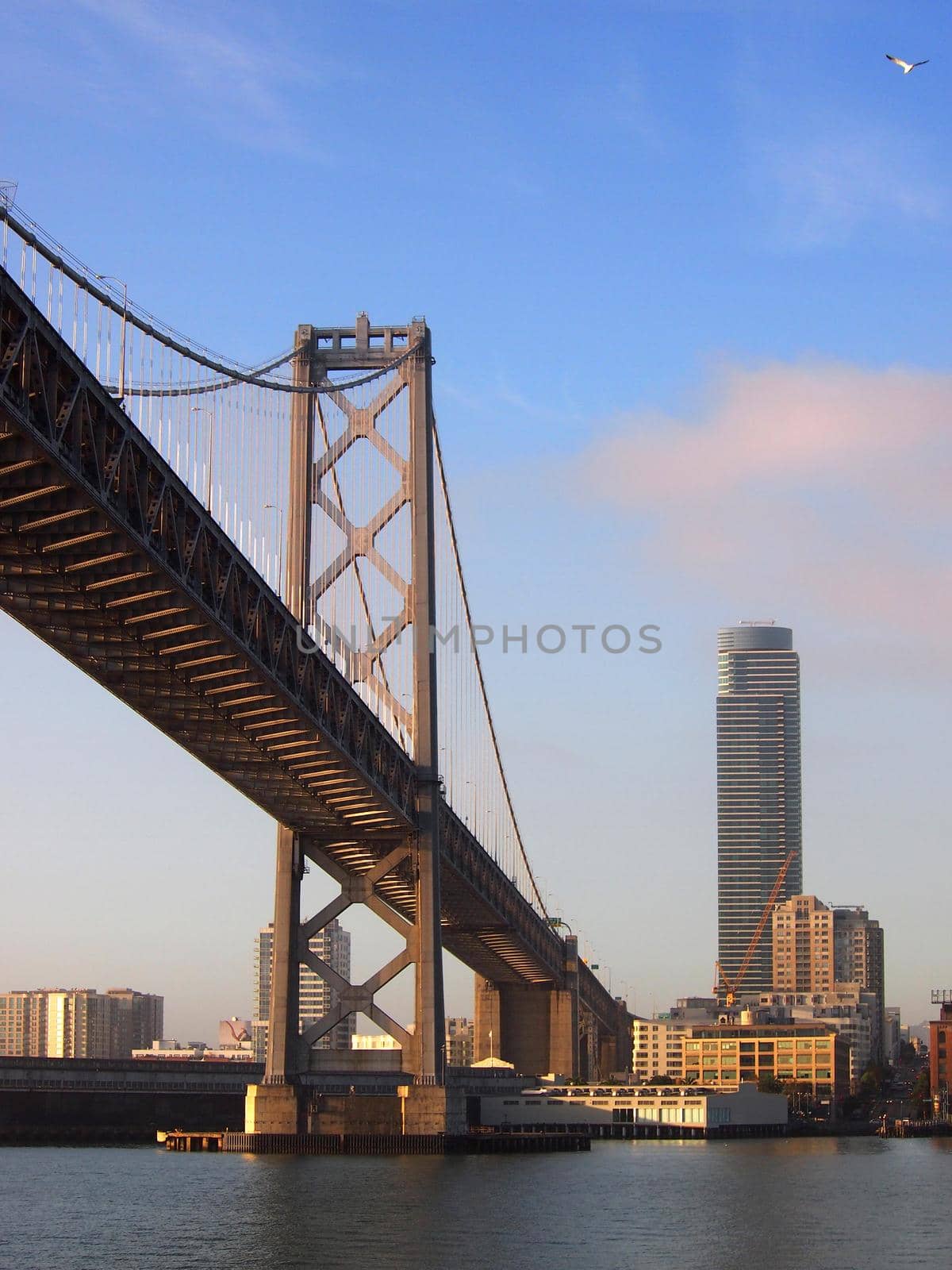 Bay Bridge and San Francisco Cityscape seen from the water in the early morning. 