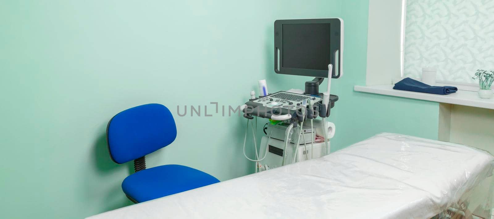 banner with empty medical office with ultrasound machine and white couch. by Leoschka