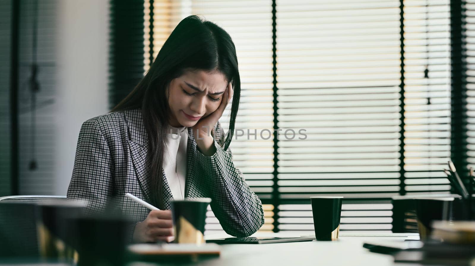 Frustrated businesswoman tired and stressed about work. Stressful life and deadlines concept.