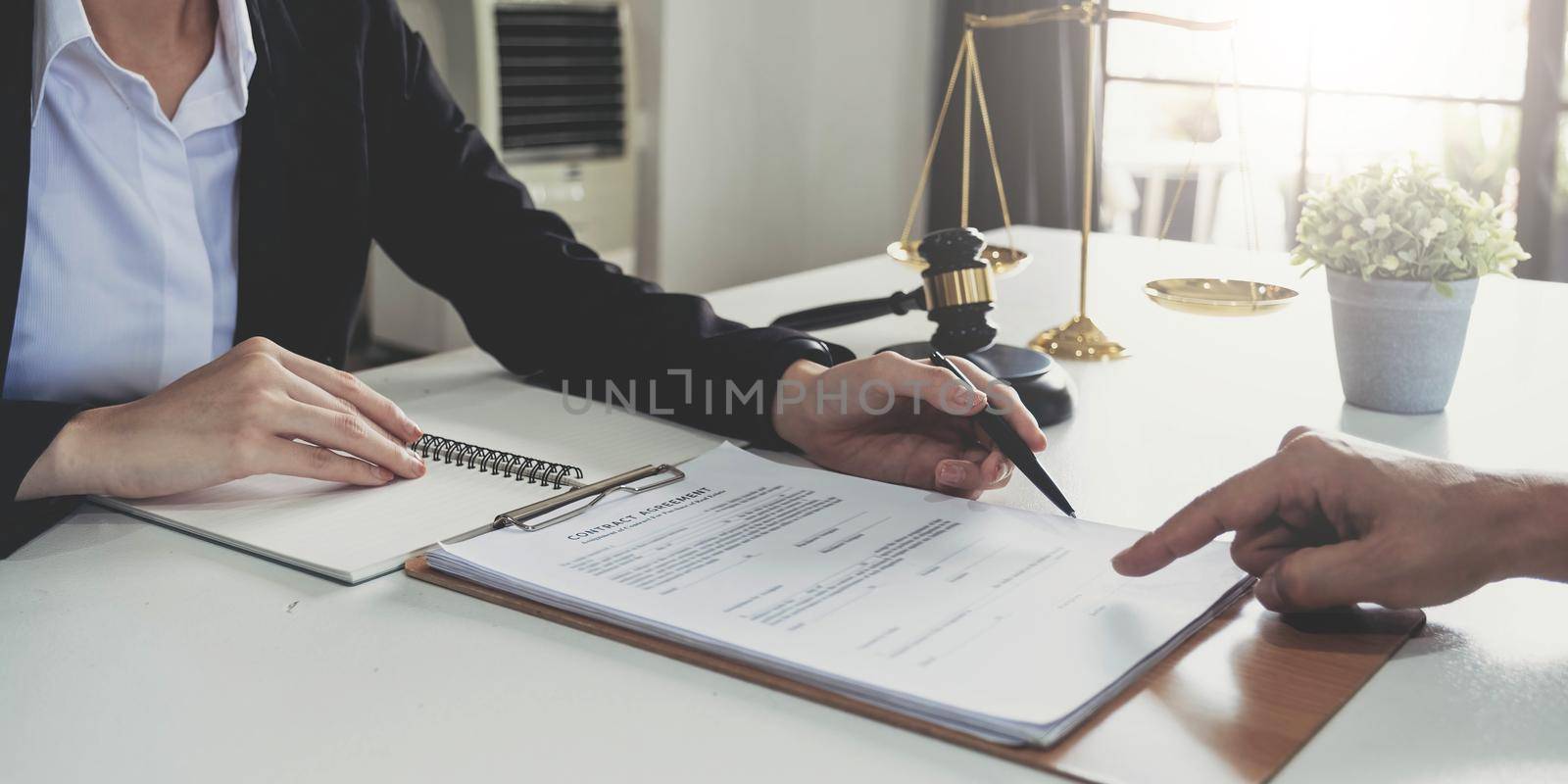 business people working together at meeting in modern office, close-up. Businessman and woman with colleagues or lawyers discussing contract at negotiation by wichayada