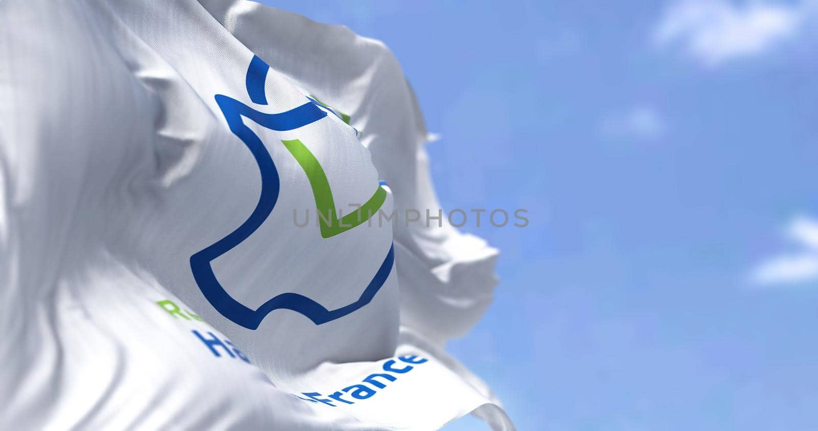 The flag of Hauts de France region waving in the wind on a clear day. Hauts de France is the northernmost region of France. 3d illustration. French administrative region