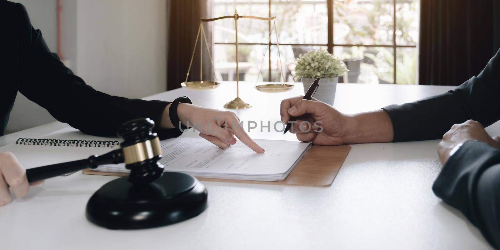 business people and lawyers discussing contract papers sitting at the table. Concepts of law, advice, legal services.