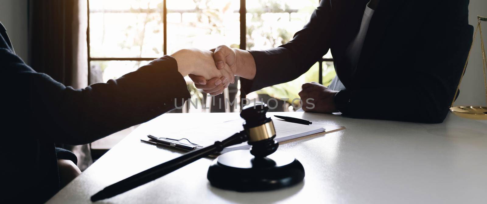 Lawyer business women shaking hands with clients, after finishing up a Consulting for insurance rent house. concept of home protection, family, insurance..