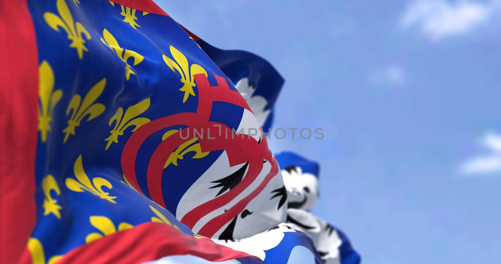 The flag of Pays de la Loire French region waving in the wind on a clear day. Pays de la Loire is one of the 18 regions of France, in the west of the mainland. French administrative region