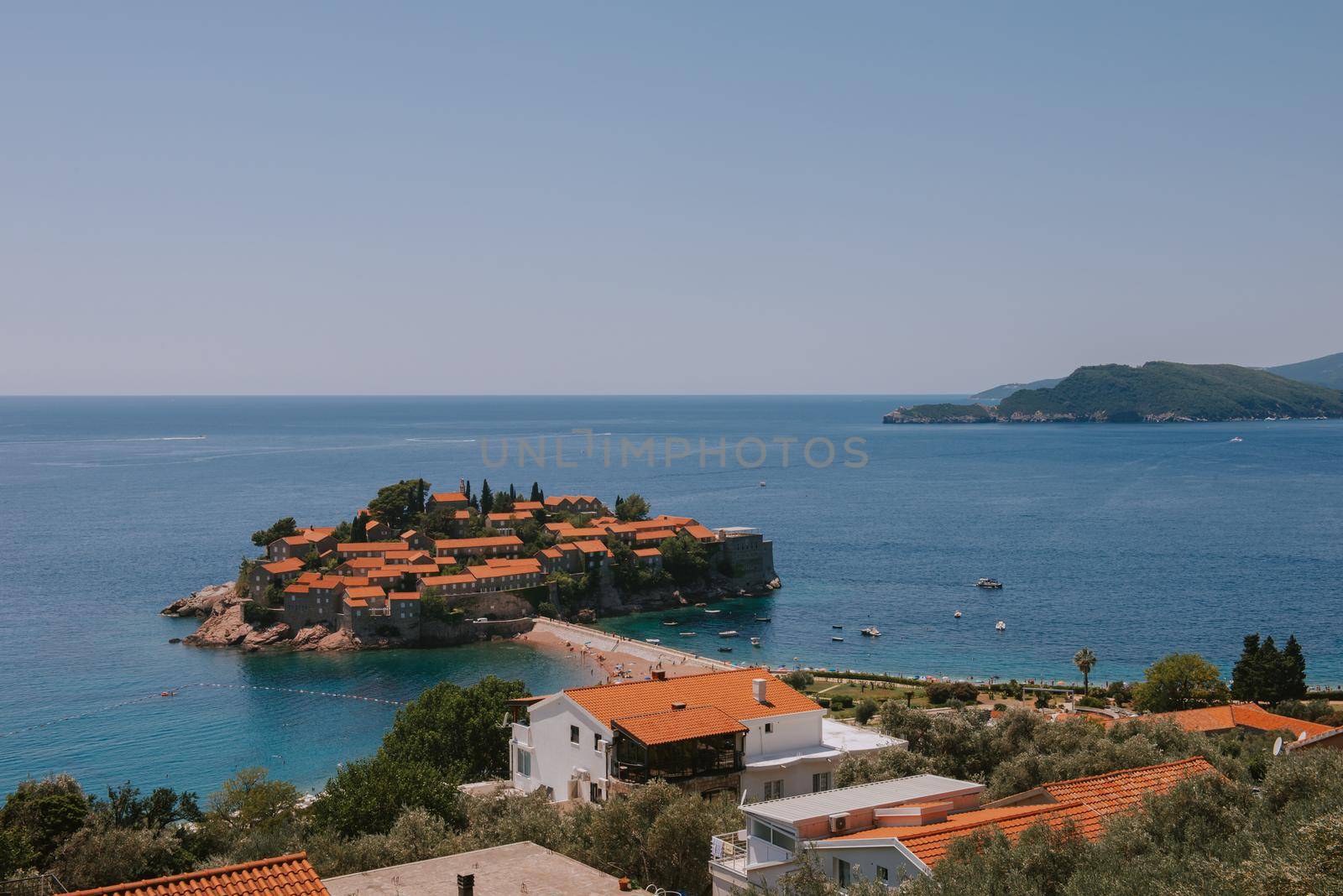 Sveti Stefan is a small isand on Adriatic coast of Montenegro near of Budva. Resort is known commercially as Aman Sveti Stefan. Sveti Stefan, Adriatic sea, Europe. Sveti Stefan peninsula on the Adriatic Sea in Budva, Montenegro