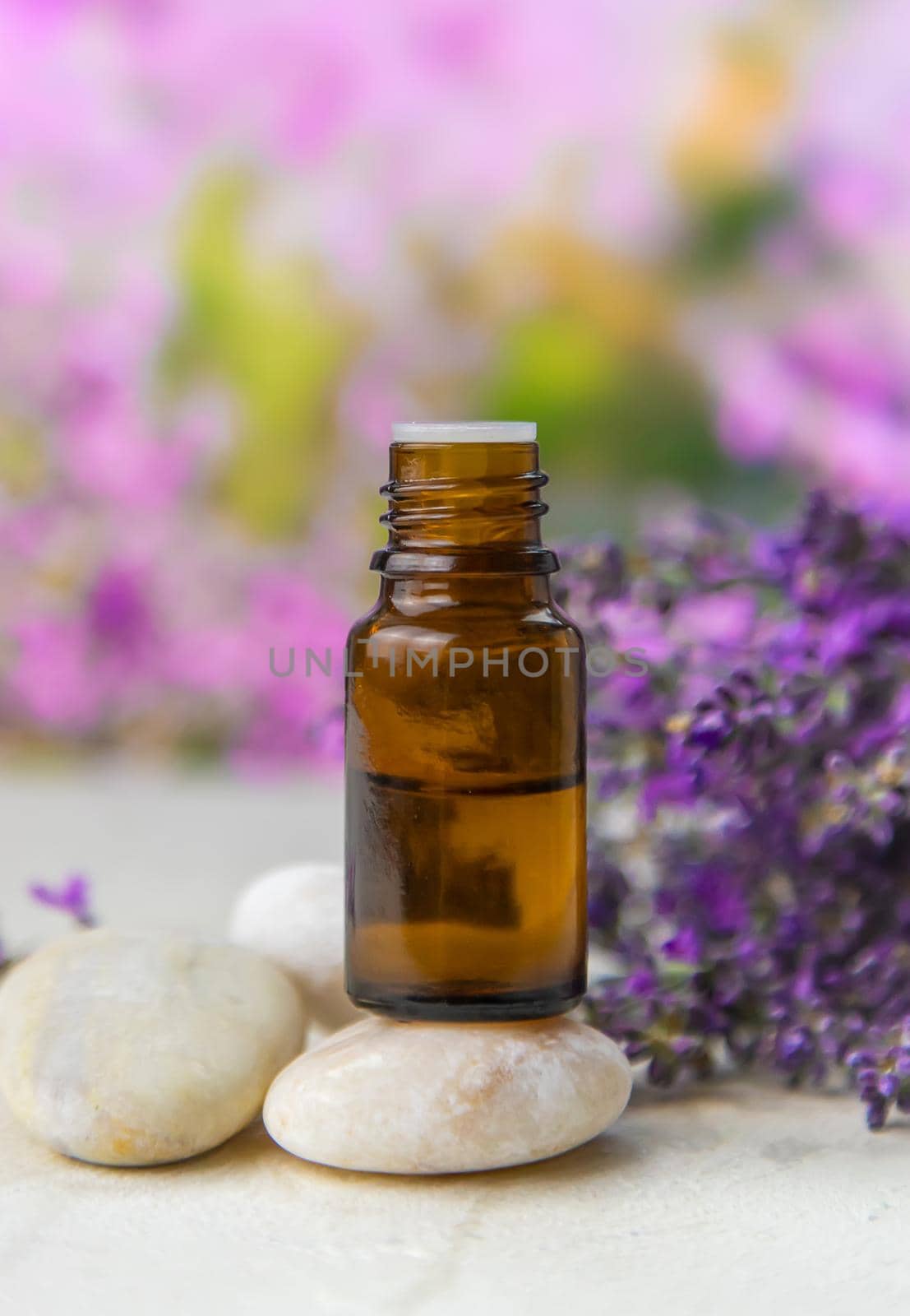 Essential oil with lavender extract. Selective focus. Nature.