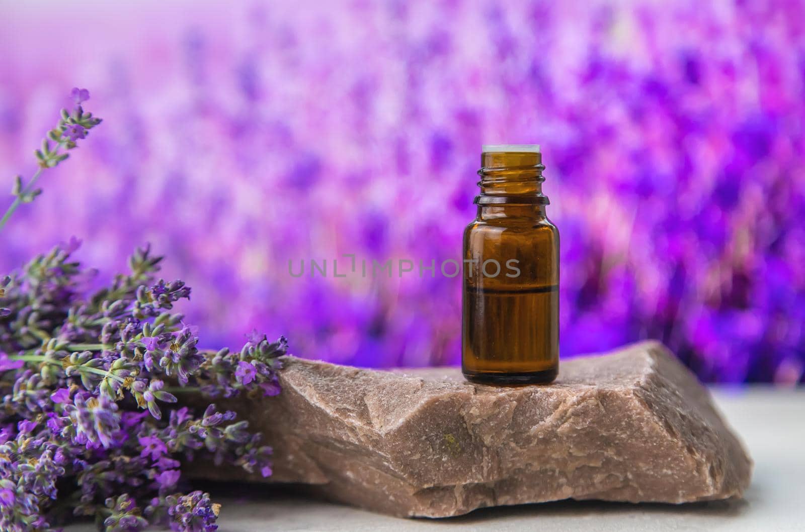 Essential oil with lavender extract. Selective focus. Nature.