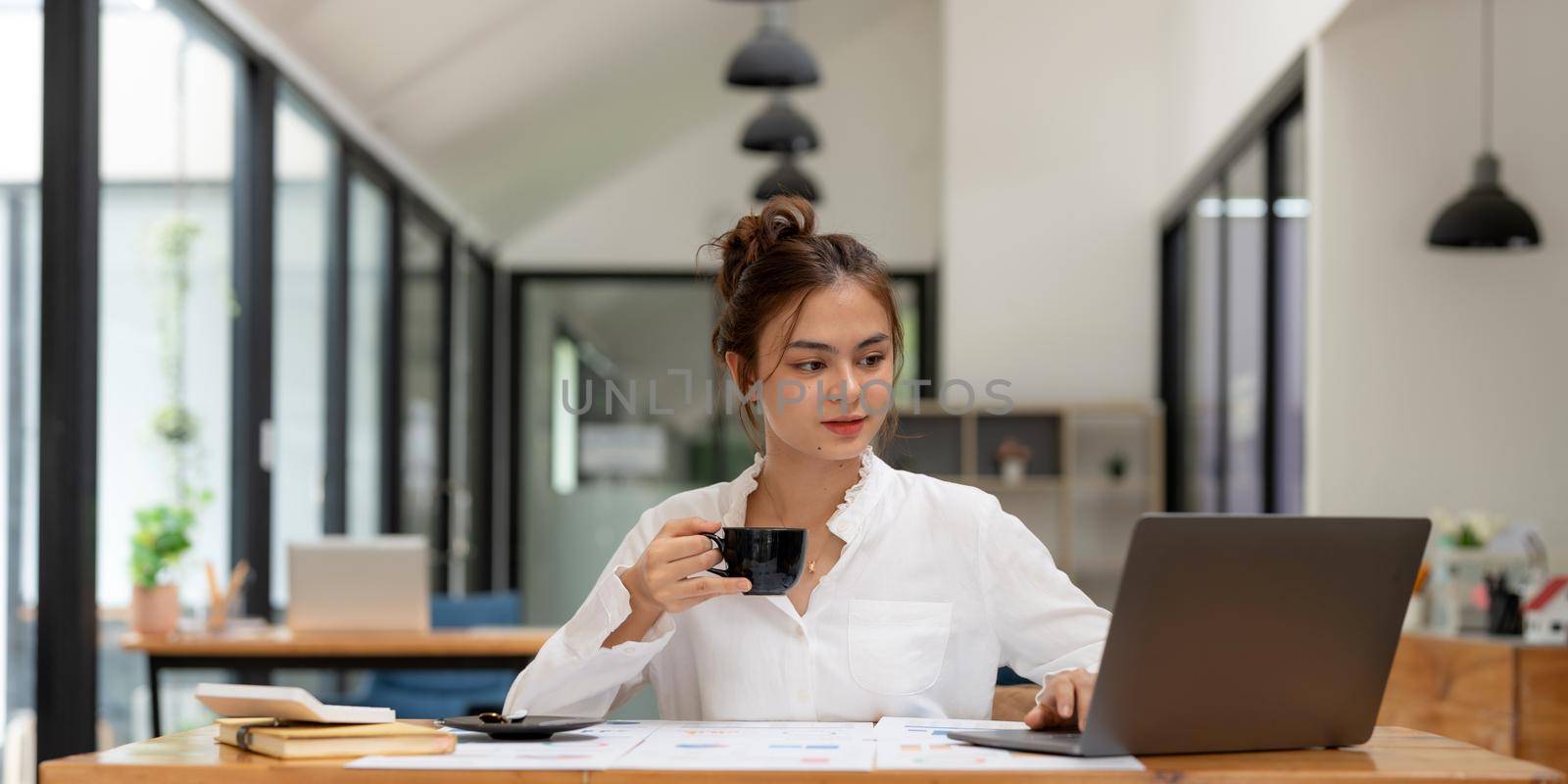 Portrait of charming successful cheerful asian girl working remotely creating finance it presentation report at home house indoor by nateemee