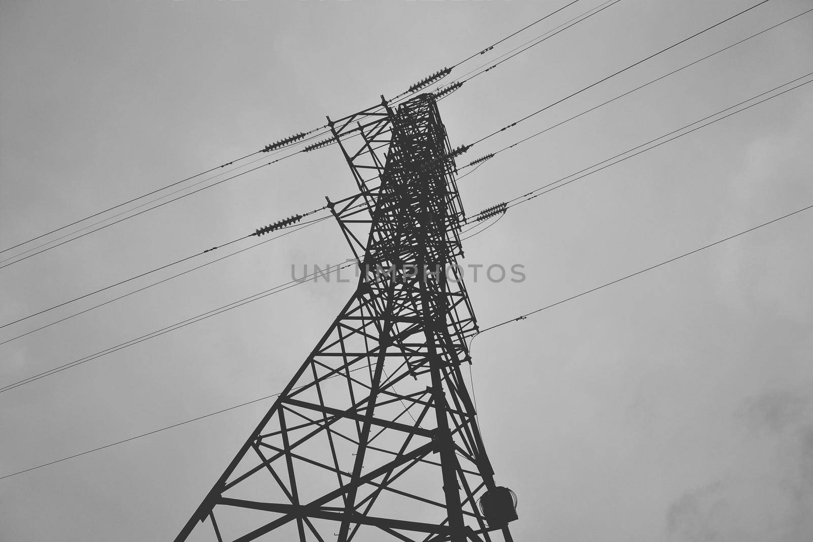 High power lines against a cloudy sky