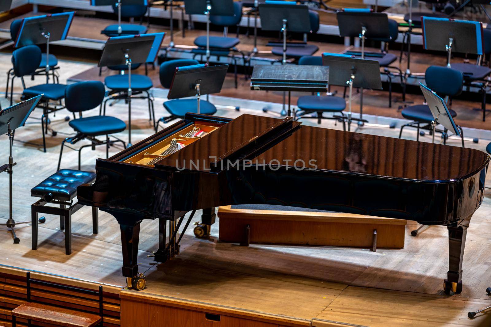 a piano on the Philharmonic stage among other musical instruments.