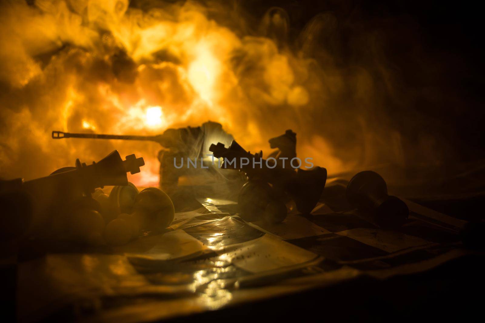 Chess board game concept of business ideas and competition and strategy ideas concep. Chess figures on a dark background with smoke and fog. Selective focus by Zeferli