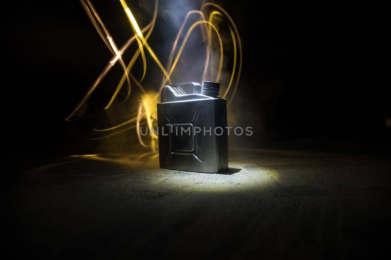 Metallic Fuel container. Canister for gasoline, diesel gas.Fire resistant storage tank on dark with backlight. Selective focus