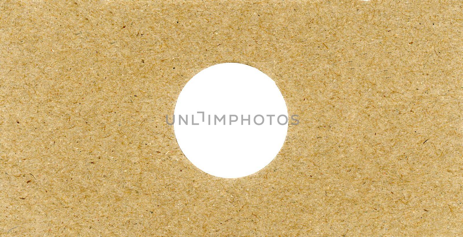 brown cardboard texture background with hole by claudiodivizia